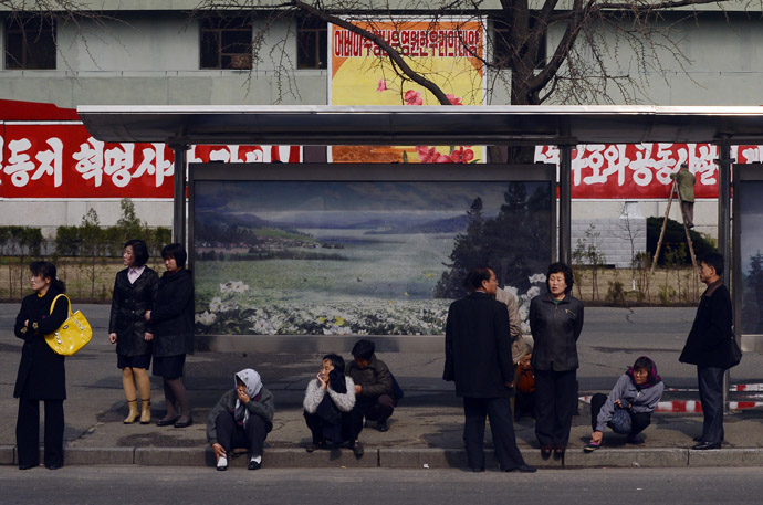 North Koreans wait for a bus in Pyongyang on April 11, 2012. (AFP Photo/Pedro Ugarte) 