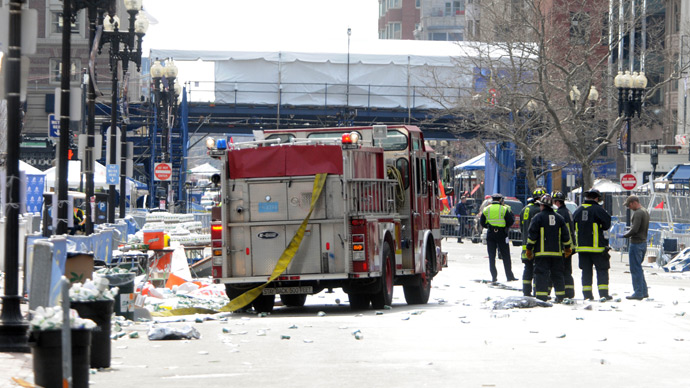 Firefighters take postion on Boyltson Street near the finish line after two bombs exploded during the 117th Boston Marathon on April 15, 2013 in Boston, Massachusetts (AFP Photo / Darren McCollester)