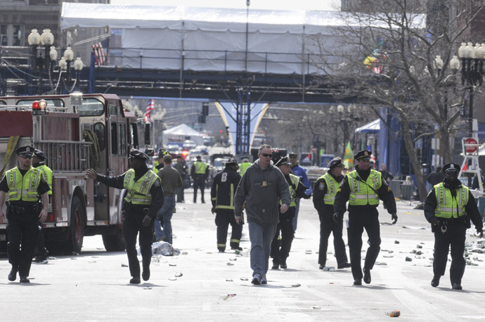 Public safety officials evacuate the scene after several explosions near the finish line of the 117th Boston Marathon in Boston, Massachusetts April 15, 2013 (Reuters / Jessica Rinaldi) 