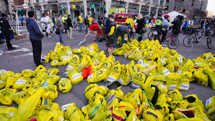 Volunteers organize participants for belongings for collection after two explosions interrupted the running of the Boston Marathon in Boston, Massachusetts April 15, 2013 (Reuters / Dominick Reuter)