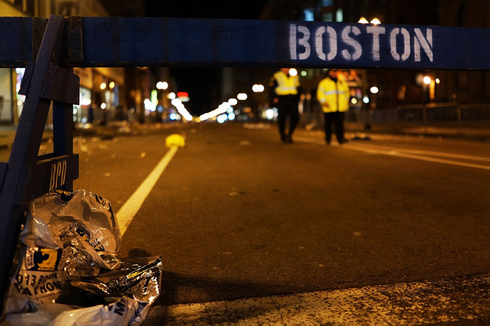 A piece of debris rests against a police barricade near the scene of a twin bombing at the Boston Marathon, on April 16, 2013 in Boston, Massachusetts (Reuters / Spencer Platt)