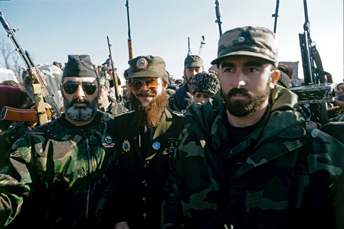Terrorist Salman Raduyev [center], one of the leaders of armed Chechen groups, with his followers at an election rally in Grozny in January 1997. (RIA Novosti)