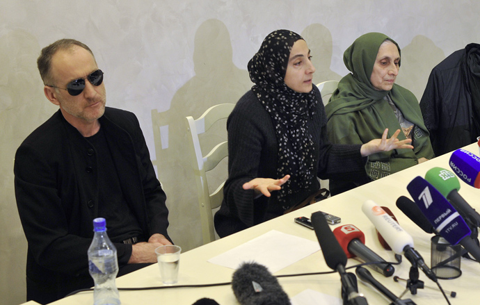 Zubeidat Tsarnaeva (C) and Anzor Tsarnaev, the parents of Tamerlan and Djokhar Tsarnaev suspected of setting up the Boston explosions, are seen at a press conference in Makhachkala (Reuters / Stringer)