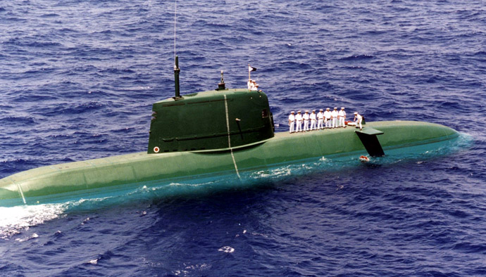 Israeli Seamen atop a new Dolphin-class submarine lay 69 wreaths in Mediterrannean Sea between Cyprus and Crete (Reuters)