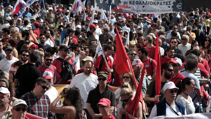 Communist-affiliated protesters and foreign workers gather at a central Athens square during a May Day rally on May 1, 2013.(AFP Photo / Louisa Gouliamaki)
