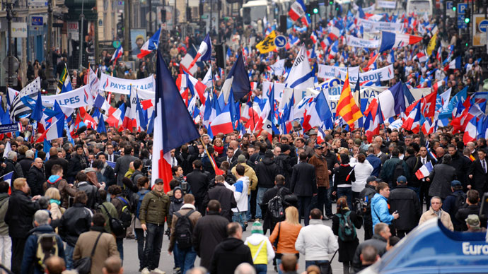 Waving French national flags, people attend French far right party Front National (FN) annual celebration of Joan of Arc on May 1, 2013 in Paris.(AFP Photo / Eric Feferberg)