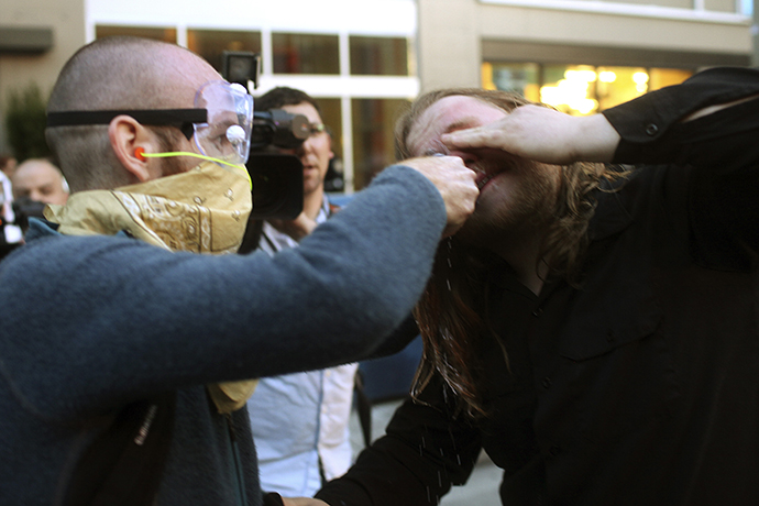 A demonstrator has milk put in his eyes to help stop the stinging of pepper spray during May Day demonstrations in Seattle, Washington May 1, 2013. (Reuters / Matt Mills McKnight)