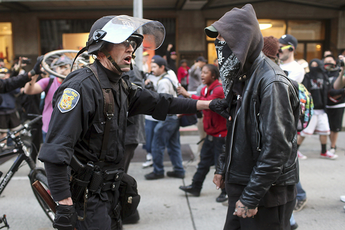 A police officer and demonstrator clash during May Day demonstrations in Seattle, Washington May 1, 2013. (Reuters / Matt Mills McKnight)