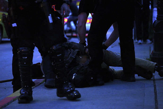 A man is detained during May Day demonstrations in Seattle, Washington May 1, 2013. (Reuters / Matt Mills McKnight)