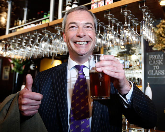 UK Independence Party (UKIP) leader Nigel Farage poses for a photograph with a pint of beer in the Marquis of Granby pub, in Westminster, in London May 3, 2013 (Reuters / Olivia Harris)