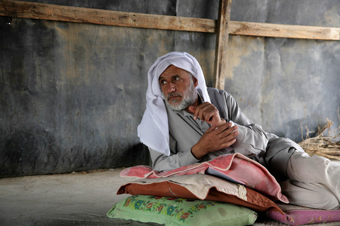 A Bedouin man sits inside a tin shaft at Wadi al-Nam unrecognized Bedouin village in the Negev desert, near the southern Israeli city of Beer Sheva (AFP Photo)