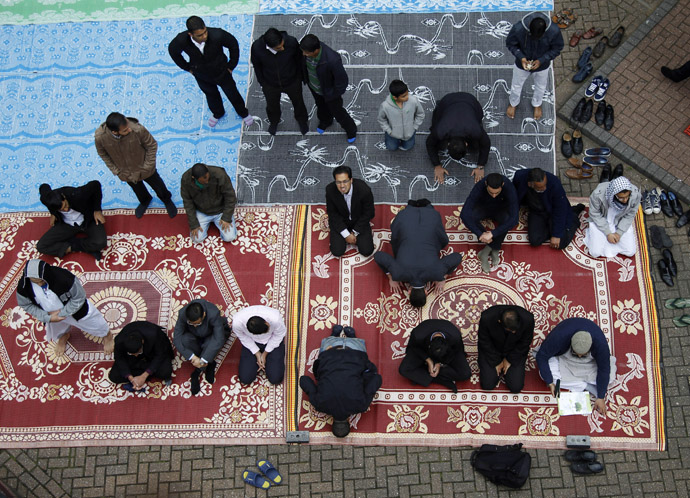Muslims attend Friday prayers on the first day of Ramadan, in the courtyard of a housing estate next to a small BBC community centre and mosque in east London (Reuters)