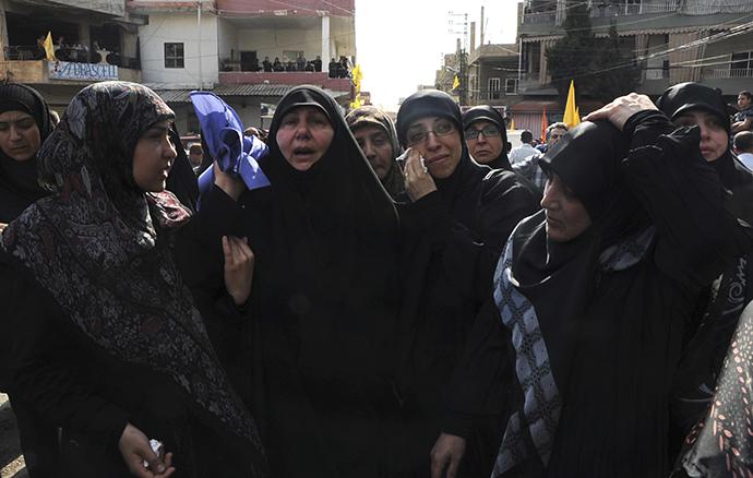 Relatives mourn during the funeral of Hasan Faisal Sheker, an 18-year-old Hezbollah member, in Nabi Sheet near Baalbeck May 20, 2013. (Reuters)