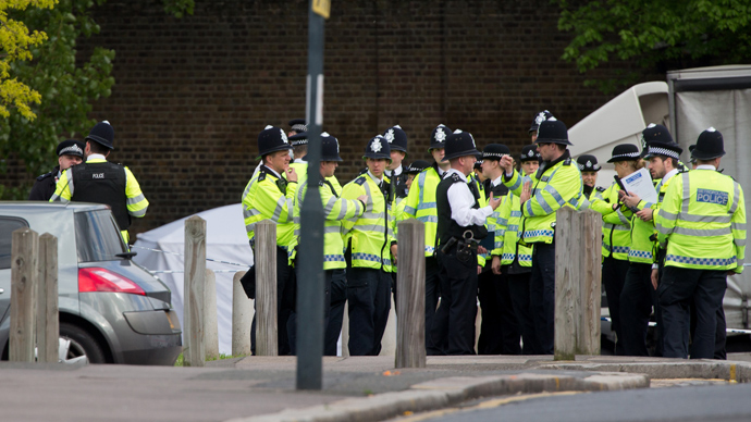 Police officers man a cordoned off area in Woolwich, east London, on May 22, 2013, following an incident in which a man was killed and two others seriously injured (AFP Photo / Leon Neal)