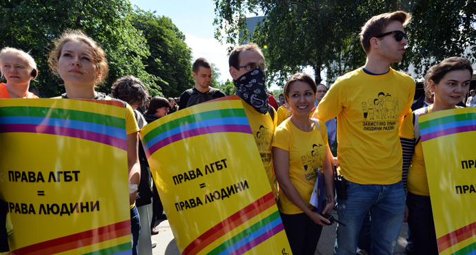 Activists carry placards reading "LGB rights are human rights" during the Gay Parade in Kiev on May 25, 2013 (AFP Photo / Sergey Supinsky)