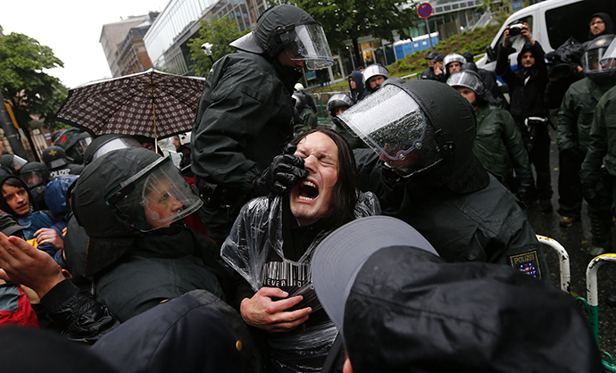 German riot police scuffle with protestors in front of the European Central Bank (ECB) head quarters during a anti-capitalism "Blockupy" demonstration in Frankfurt, May 31, 2013. (Reuters / Kai Pfaffenbach)