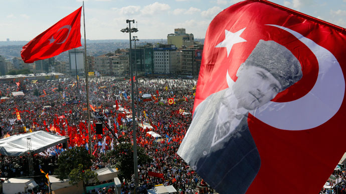 An anti-government protester waves a Turkish flag depicting the founder of modern Turkey Mustafa Kemal Ataturk as thousands of protesters gather in Istanbul's Taksim square June 9, 2013.(Reuters / Yannis Behrakis)