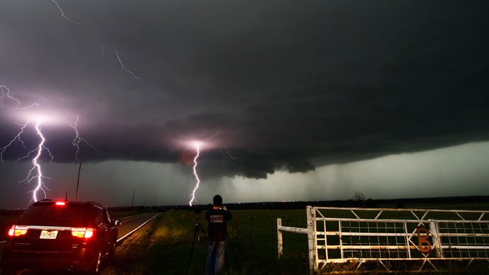 Cloud to ground lightning strikes near storm chasers during a tornadic thunderstorm in Cushing May 31, 2013. (Reuters / Gene Blevins)