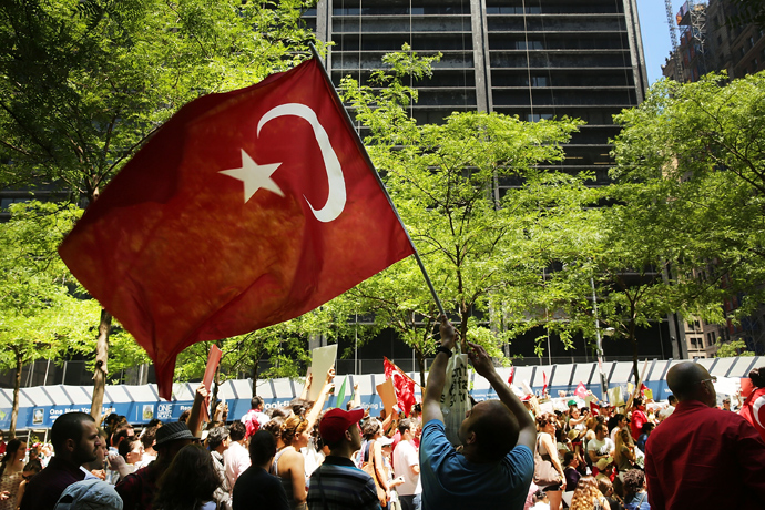 Hundreds of people, including many Turkish Americans and members of the Occupy Wall Street movement, protest in Zuccotti Park in solidarity with demonstrators in Istanbul who are trying to stop a popular park from being demolished to make way for a shopping center on June 1, 2013 in New York City (AFP Photo / Spencer Platt)