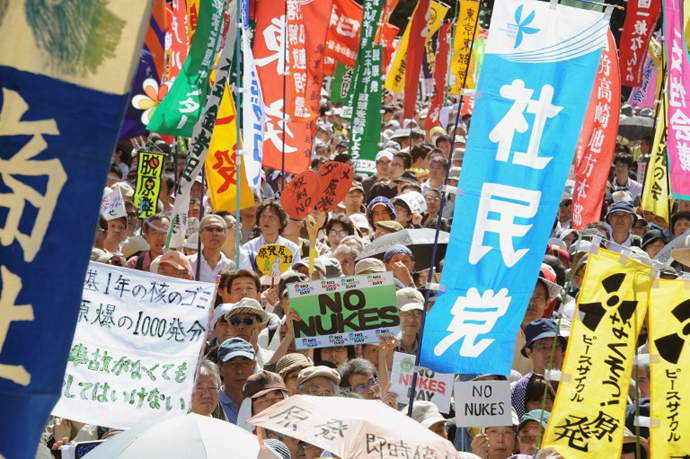Protesters hold banners during a protest rally against nuclear power plants, following the March 2011 Fukushima meltdown-disasters, in Tokyo on June 2, 2013. (AFP Photo / Rie Ishii)
