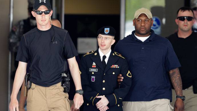U.S. Army Private First Class Bradley Manning (2nd L) departs after day two of his court-martial at Fort Meade, Maryland June 4, 2013.(Reuters / Gary Cameron)