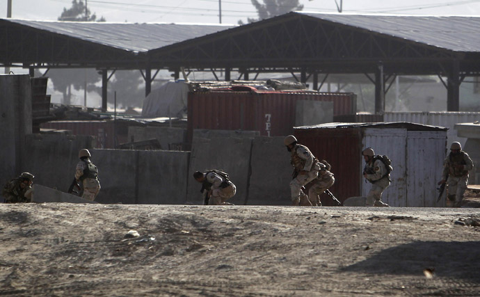 Afghan security forces take their position at the site of an attack in Kabul June 10, 2013. (Reuters/Omar Sobhani)