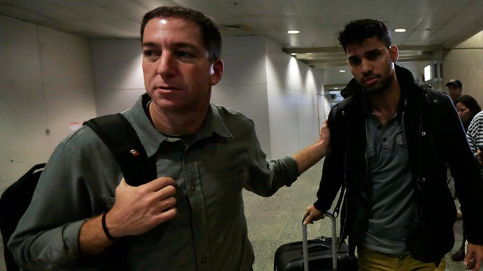 U.S. journalist Glenn Greenwald (L) walks with his partner David Miranda in Rio de Janeiro's International Airport August 19, 2013. (Reuters / Ricardo Moraes)