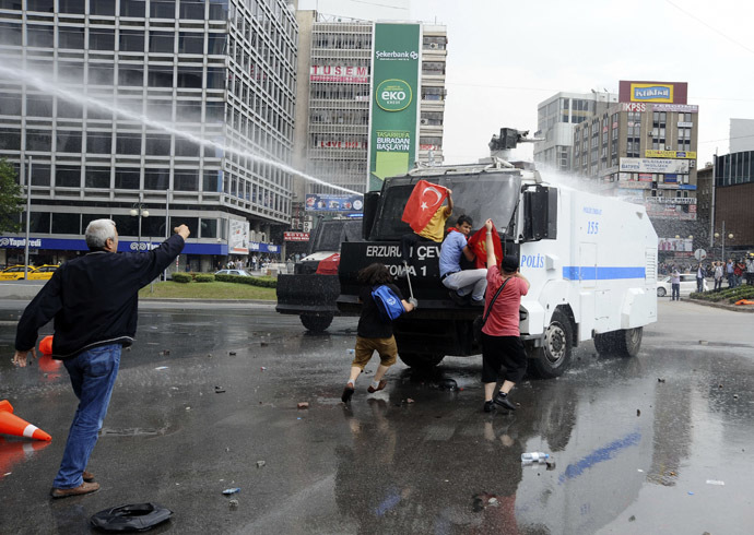 Riot police use a water cannon to disperse anti-government protesters in Ankara June 16, 2013. (Reuters)