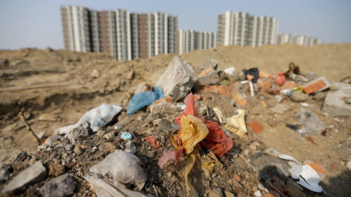 Household garbage and construction waste are placed next to a residential area in Beijing.(Reuters / Jason Lee)