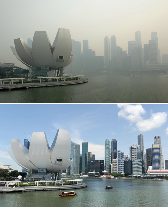 A combination of pictures shows (top) a view of the city skyline shrouded by haze in Singapore on June 20, 2013 and a file picture (bottom) showing the same view on a clear day taken on April 13, 2012. (AFP Photo)