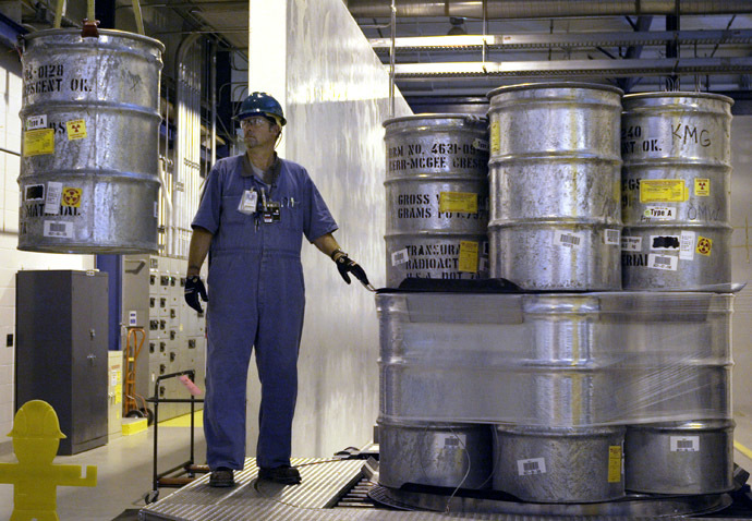 55-gallon drums containing transuranic (TRU) waste are prepared for shipment at the Waste Receiving and Processing facility (WARP) on the Hanford Nuclear Reservation, 30 June, 2005 near Richland, Washington. (Jeff T. Green/Getty Images/AFP)