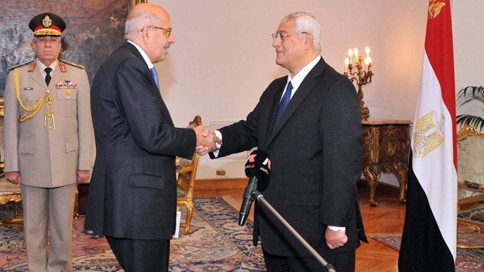 A handout picture released by the Egyptian Presidency shows Egyptian leader Mohamed ElBaradei (C) being sworn in as Egypt's interim vice president for foreign relations, in front of Egypt's interim president Adly Mansour (R), in Cairo on July 14, 2013 (AFP Photo)