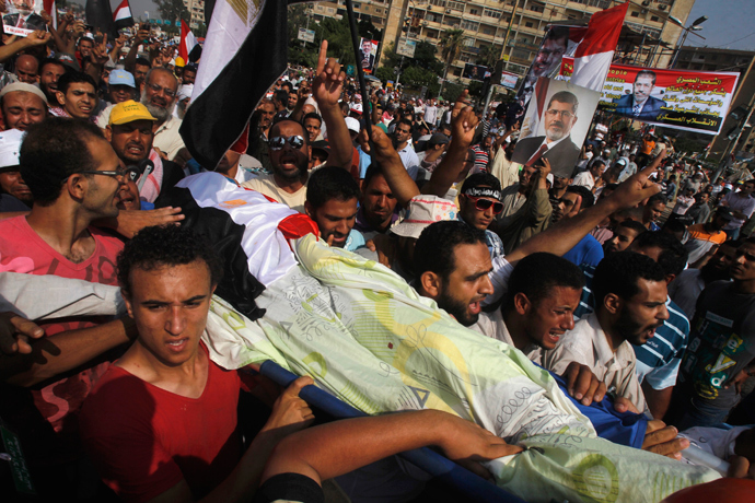 People celebrate at Tahrir Square after a broadcast by the head of the Egyptian military confirming that they will temporarily be taking over from the country's first democratically elected president Mohammed Morsi on July 3, 2013 in Cairo (AFP Photo / Khaled Desouki)