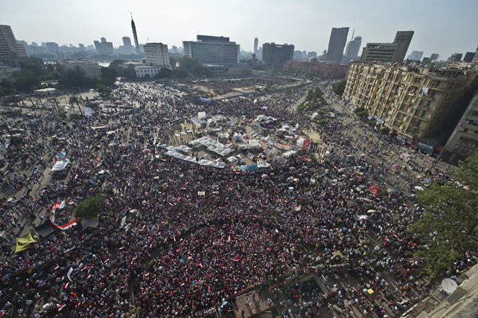 Opponents of Egyptian President Mohamed Morsi gather during a protest calling for his ouster at Cairo's landmark Tahrir Square, on July 2, 2013. (AFP Photo / Khaled Desouki)