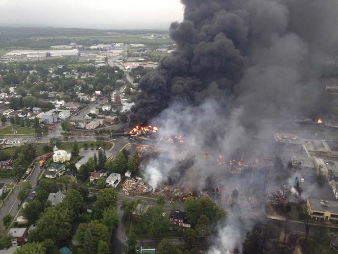 Smoke billows from a fire at the site of a train derailment in Lac Megantic, Quebec in this July 6, 2013 aerial handout photo. (Reuters/Surete du Quebec)