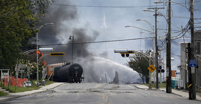 A burning train wagon is seen after an explosion at Lac Megantic, Quebec, July 6, 2013. (Reuters/Mathieu Belanger)