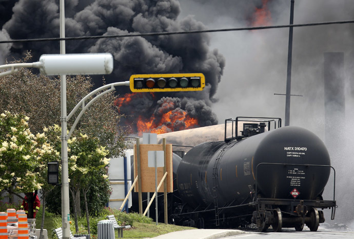 A burning train wagon is seen after an explosion at Lac Megantic, Quebec, July 6, 2013 (Reuters/Mathieu Belanger)
