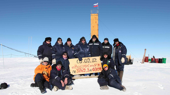 A handout photo provided by the Russiaâs Arctic and Antarctic Research Institute taken at the Vostok station in Antarctica on February 5, 2012, shows Russian researchers posing for a picture after reaching the subglacial lake Vostok (AFP Photo)