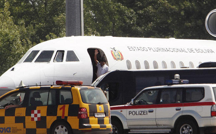 Bolivian President Evo Morales waves from his plane before leaving the Vienna International Airport in Schwechat July 3, 2013. (Reuters/Heinz-Peter Bader)