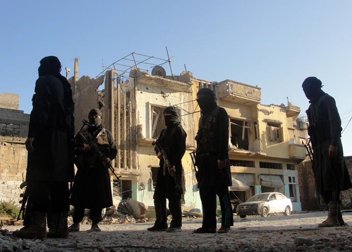 A handout picture released by the opposition-run Shaam News Network on July 2, 2013 shows rebel fighters scouting the area in Syria's central city of Homs (AFP Photo / HO / Shaam News Network)