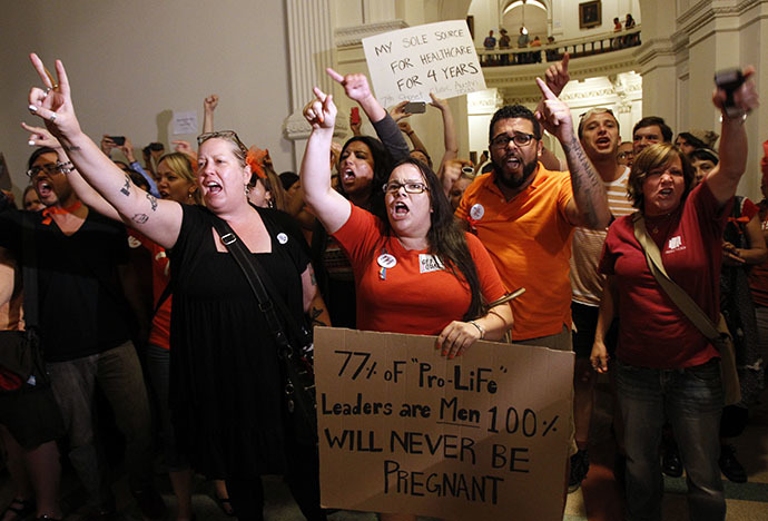 Abortion rights activists demonstrate outside the floor of the House after the HB2 bill restricting abortion rights passed in Austin, Texas July 9, 2013. (Reuters / Mike Stone)