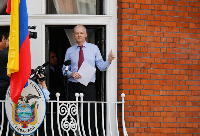 Wikileaks founder Julian Assange gestures as he appears to speak from the balcony of Ecuador's embassy, where he is taking refuge in London (Reuters / Chris Helgren)