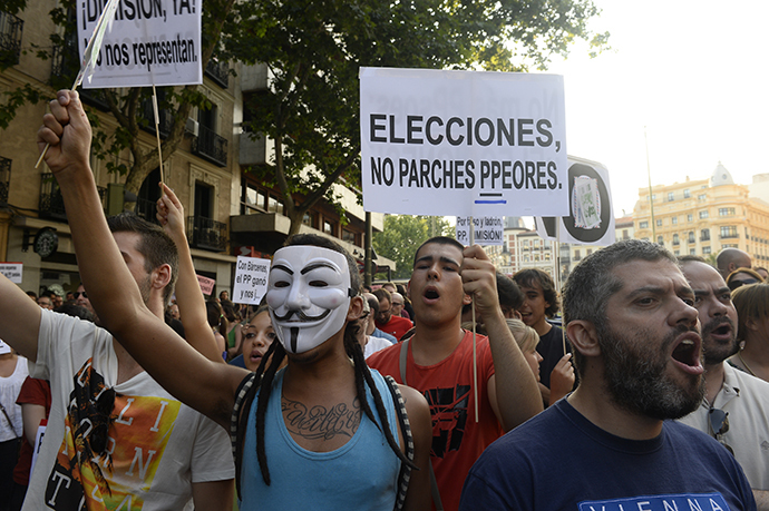 People hold a poster reading "Elections, no worst patch" as they protest against Spanish Prime Minister Mariano Rajoy outside the headquarters of the PP (Popular Party) in Madrid on July 18, 2013. (AFP Photo / Pierre-Philippe Marcou)