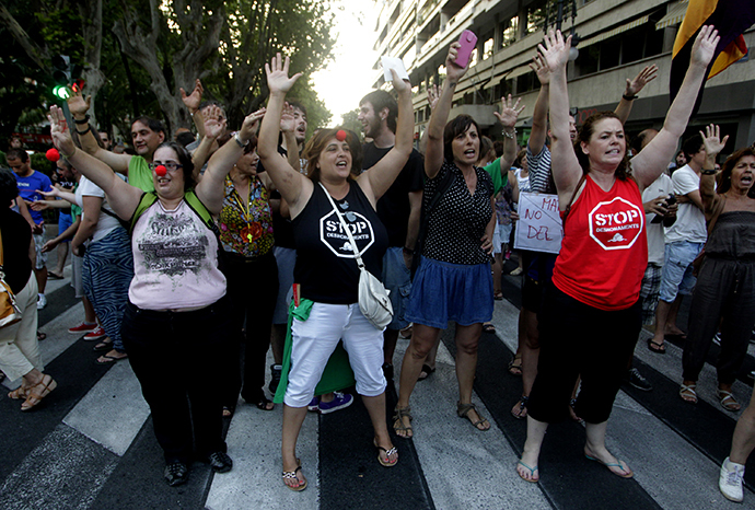 Protesters block the Gran Via Avenue during a demonstration against the People's Party (Popular Party) in Valencia, July 18, 2013. (Reuters / Heino Kalis)