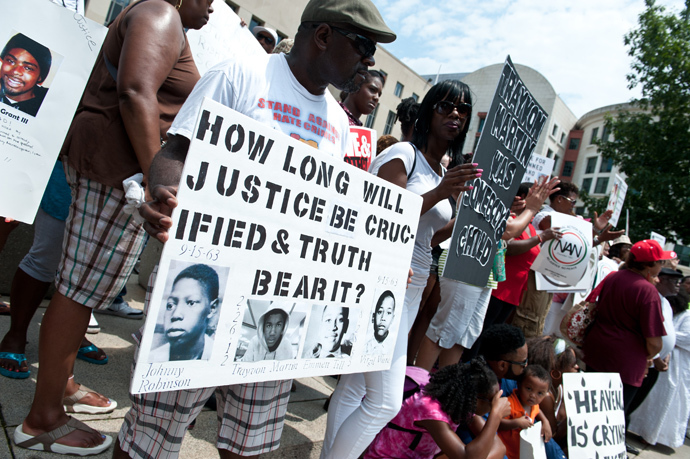 People demonstrate in Washington on July 20, 2013, one week after the acquittal of George Zimmerman (AFP Photo / Nicholas Kamm) 