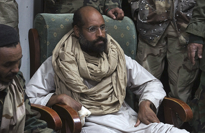 Saif al-Islam is seen after his capture, in the custody of revolutionary fighters in Obari, Libya November 19, 2011. (Reuters)