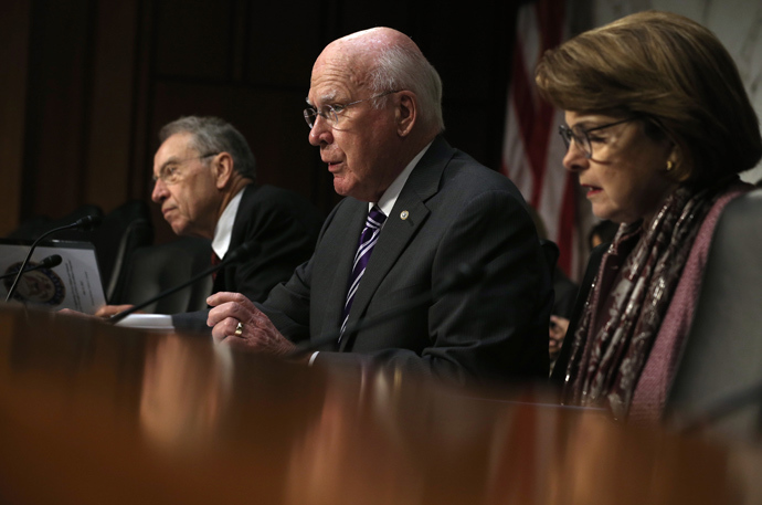 Committee Chairman Sen. Patrick Leahy (D-VT) (C) speaks as ranking member Sen. Charles Grassley (R-IA) (L) and Sen. Dianne Feinstein (D-CA) listen during a hearing before the Senate Judiciary Committee July 31, 2013 on Capitol Hill in Washington, DC (AFP Photo / Alex Wong)