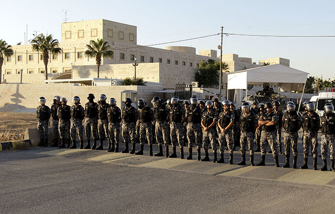 Jordanian priot police stand guard outside the US embassy in Amman on September 14, 2011 during a protest against the US policies in the Middle East. (AFP Photo / Khalil Mazraawi)