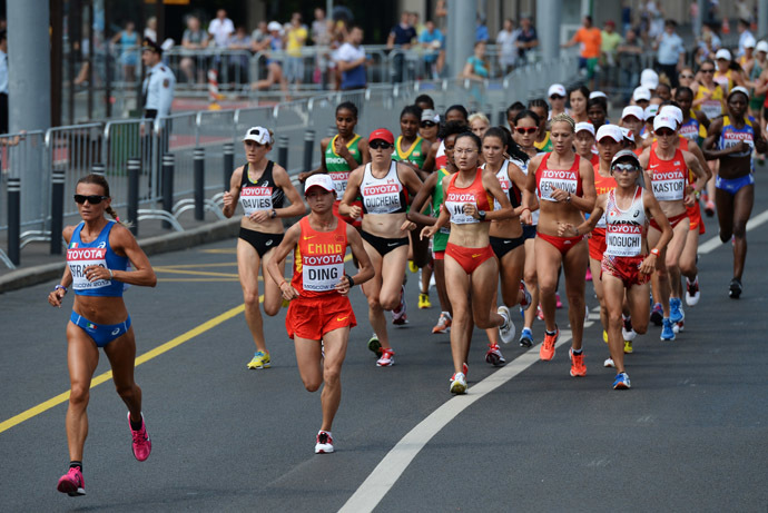 Italy's Valeria Straneo, left, in the women's marathon at the World Athletics Championships in Moscow. (RIA Novosti/Alexey Filippov)