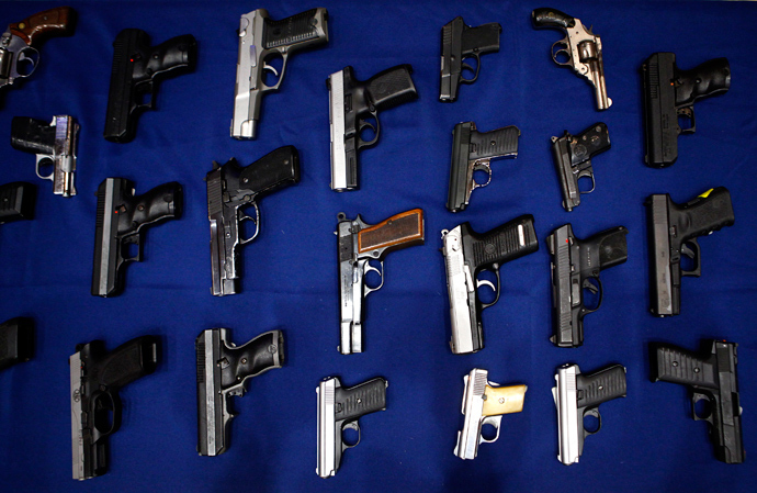 Seized guns are pictured at the police headquarters in New York August 19, 2013 (Reuters / Eric Thayer)